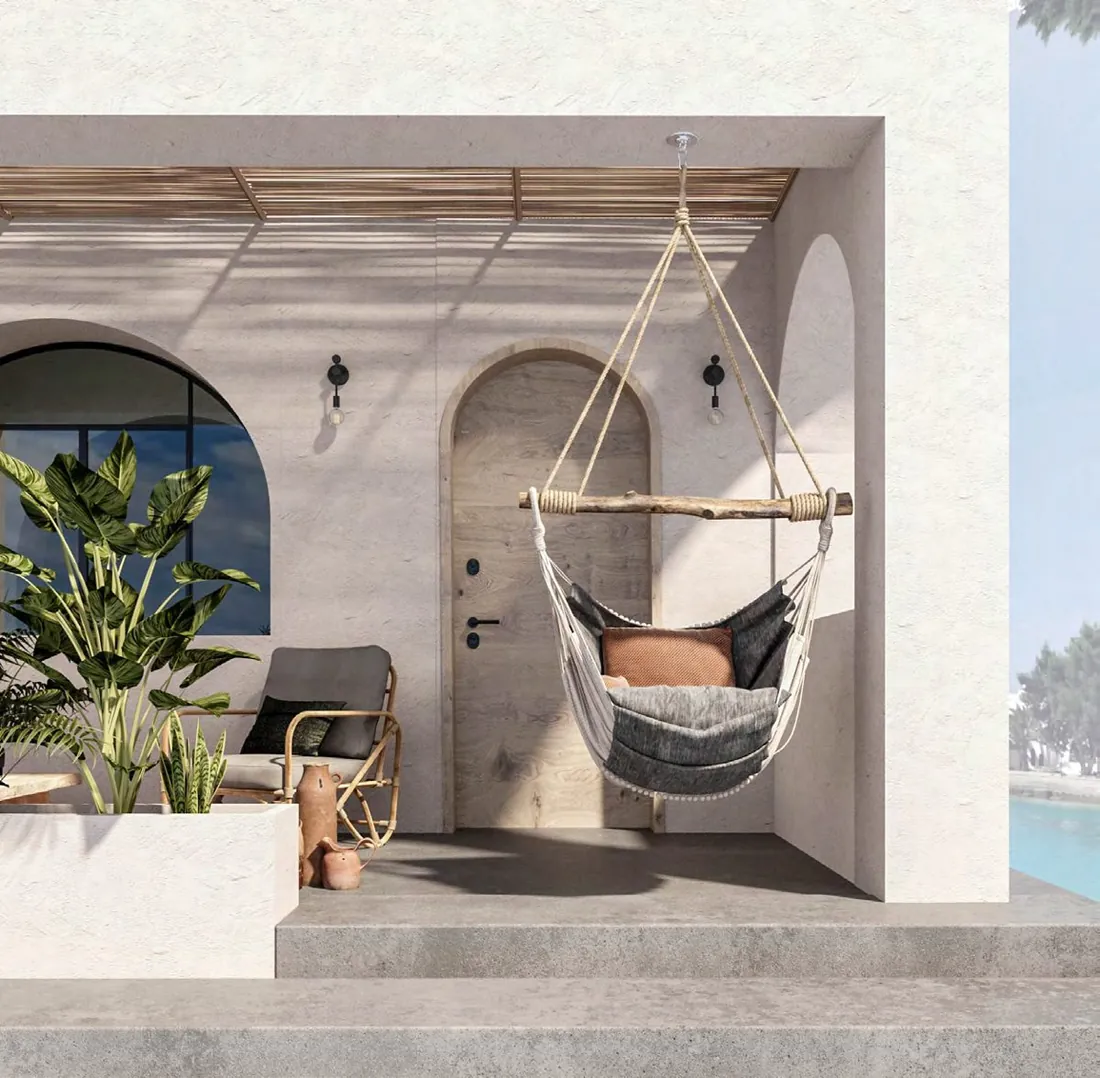 Arabella Room terrace with built-in seating and rattan armchair