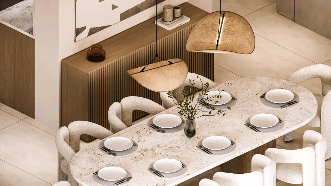 AK Home dining table seen from above with pendant lights and fluted sideboard