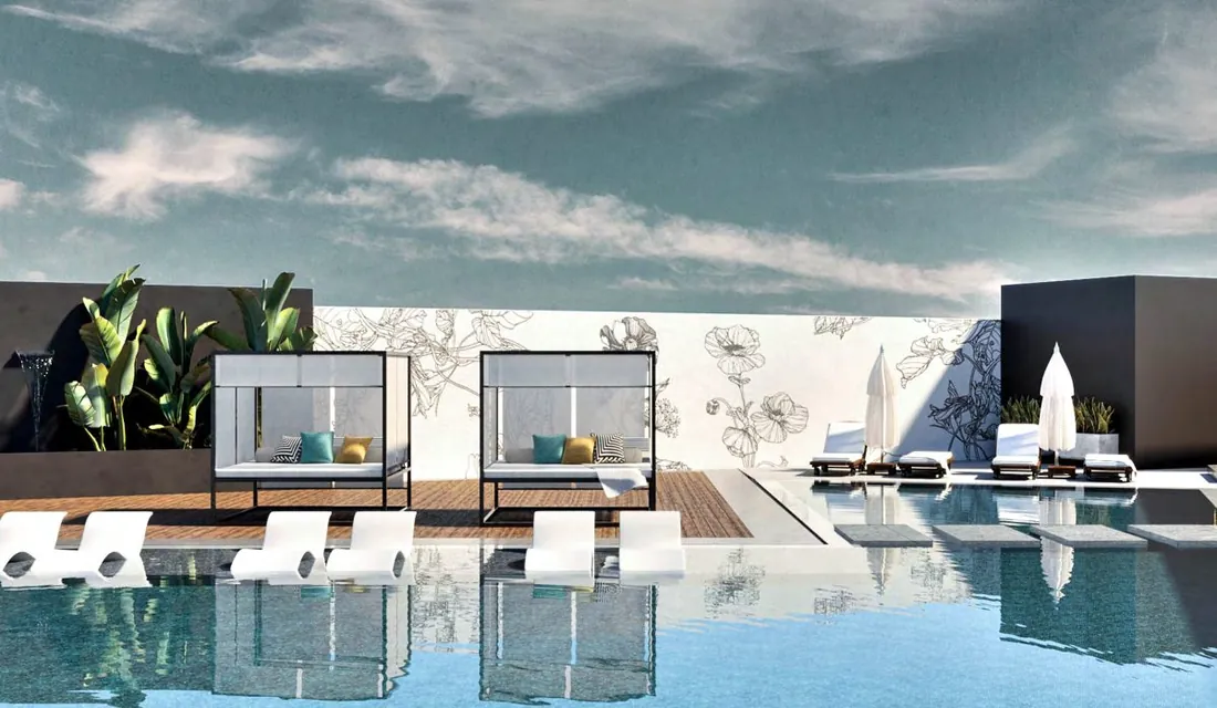 UTH Hotel pool with daybeds and loungers