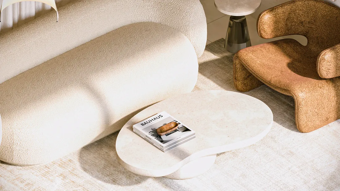 AK Home seating corner seen from above with boucle sofa and rust armchair