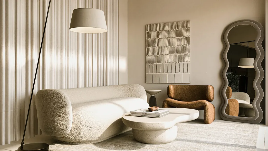 AK Home seating corner with boucle sofa, textured artwork and wavy mirror