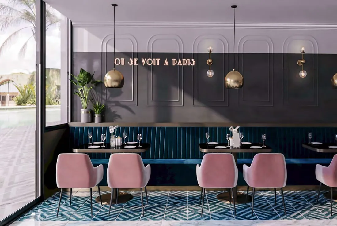 Marlin Restaurant dining area with pink chairs and teal booths