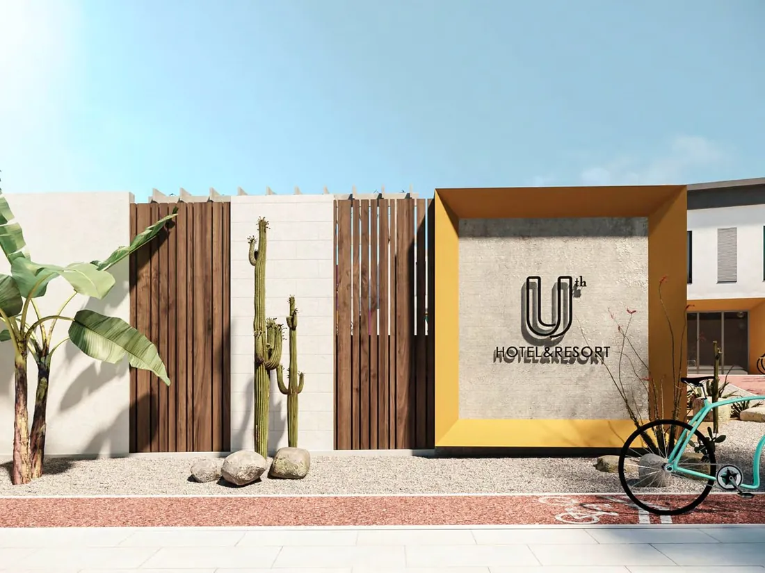 UTH Hotel entrance signage with cacti and bicycle