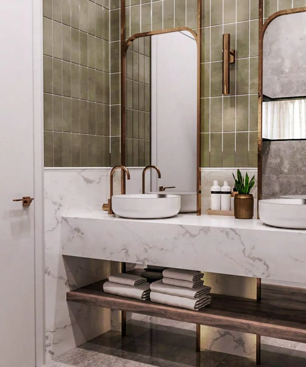 Marlin Inn Hotel bathroom with sage tile and brass fixtures