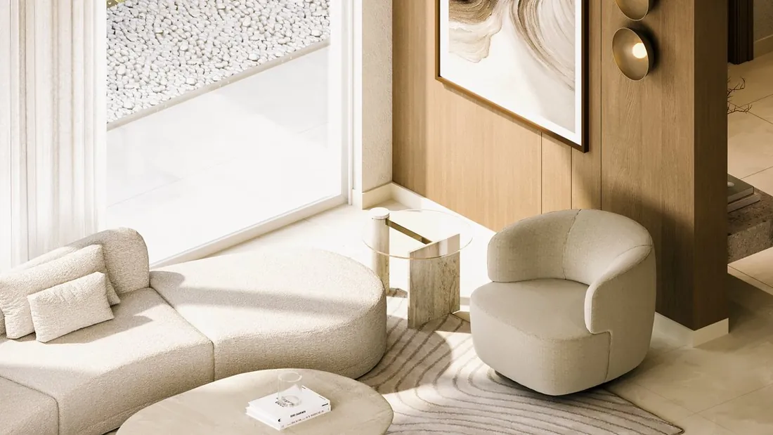 AK Home reception with curved boucle sofa and travertine side table