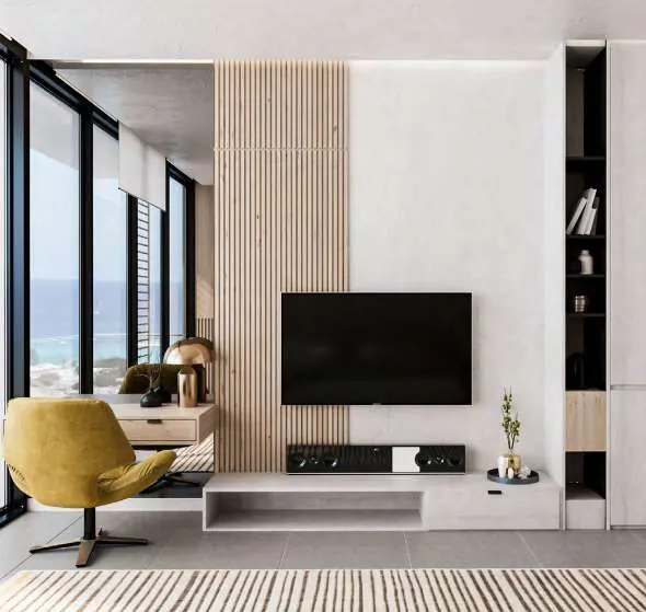 Bedroom lounge area with TV wall and mustard armchair