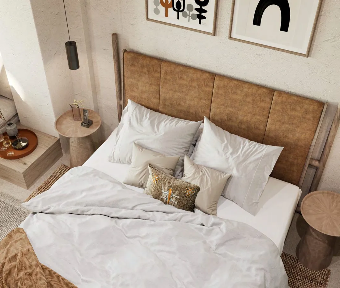 Arabella Room bedroom with leather headboard and abstract art