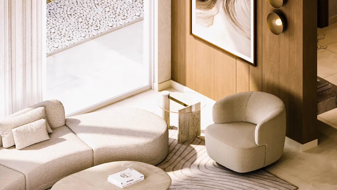 AK Home reception seen from above with curved sofa, travertine side table and swivel armchair
