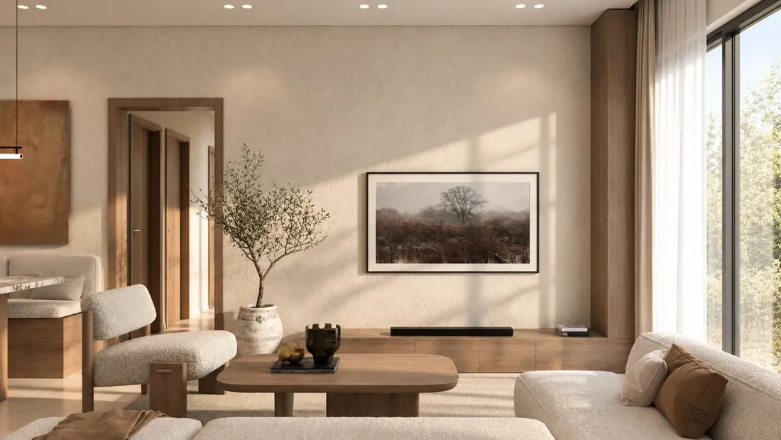 H Studio living room TV wall with framed artwork